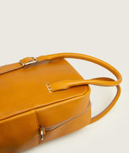 Load image into Gallery viewer, GUT OGGAU x SAGAN Vienna bag red I view from top I showing the bag lying on the back, showing belt detail and watoji detail I white background