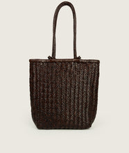 Load image into Gallery viewer, Woven I Pazar Book Tote Handwoven I brown I back view I showing the iconic SAGAN closure strap and the front Book pocket I white background