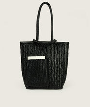 Load image into Gallery viewer, Woven I Pazar Book Tote Handwoven I black I front view I showing the iconic SAGAN closure strap and the front Book pocket I white background