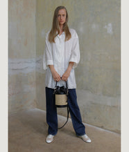 Load image into Gallery viewer, Vienna bucket bag, size S in black from Italian calf leather. Short signature hand knotted handle with additionally long thin removable shoulder strap. Inner pocket. D-key ring.