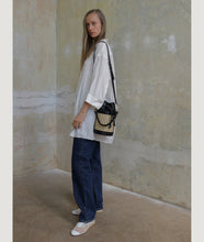 Load image into Gallery viewer, Vienna bucket bag, size S in black from Italian calf leather. Short signature hand knotted handle with additionally long thin removable shoulder strap. Inner pocket. D-key ring.