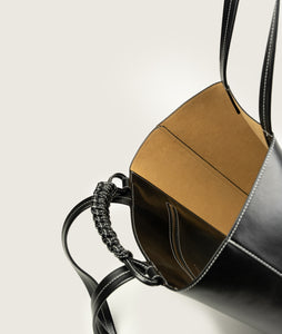Pazar I Pazar Book Tote Grape Leather I Black with white Stitching I inside view I showing the iconic closure system and the inner pocket I white background