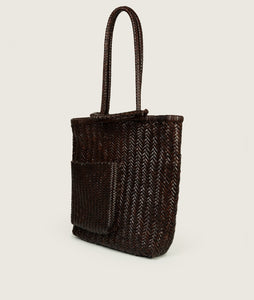 Woven I Pazar Book Tote Handwoven I brown I from aside I showing the iconic SAGAN closure strap and the front Book pocket I white background 