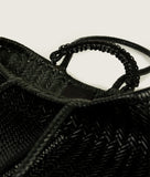 Load image into Gallery viewer, Woven I Pazar Book Tote Handwoven I black I inside view I showing the iconic SAGAN closure strap and the inside SAGAN Logo I white background 