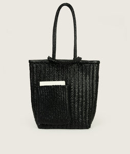 Woven I Pazar Book Tote Handwoven I black I front view I showing the iconic SAGAN closure strap and the front Book pocket I white background 