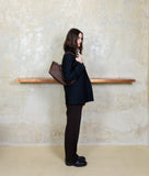 Load image into Gallery viewer, Woven I Pazar Tote Boat Handwoven I brown I from aside I woman wearing the bag over her shoulder at SAGAN Vienna Shop