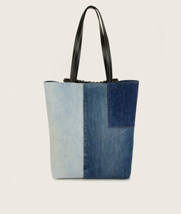 Backside of Pazar Tote Denim bag from re-used denim, sustainable, vegan Italian grape leather. jeans comes in slightly different shades, hand braided signature leather handle.