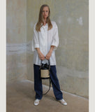 Load image into Gallery viewer, Vienna bucket bag, size S in black from Italian calf leather. Short signature hand knotted handle with additionally long thin removable shoulder strap. Inner pocket. D-key ring.