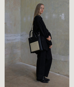 Vienna Shopper Tote bag in color black. Wiener Geflecht framed with Italian calf leather.  Long removable shoulder strap with signature hand knotted shoulder handle. Additionally short handle. Exquisite signature style. 