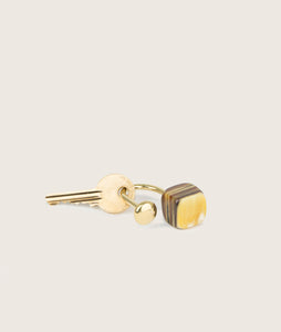 Keychain made by Carl Auböck with our signature cow horn design. 100% brass, every piece comes in different shades of cow horn due to the natural property of the material.